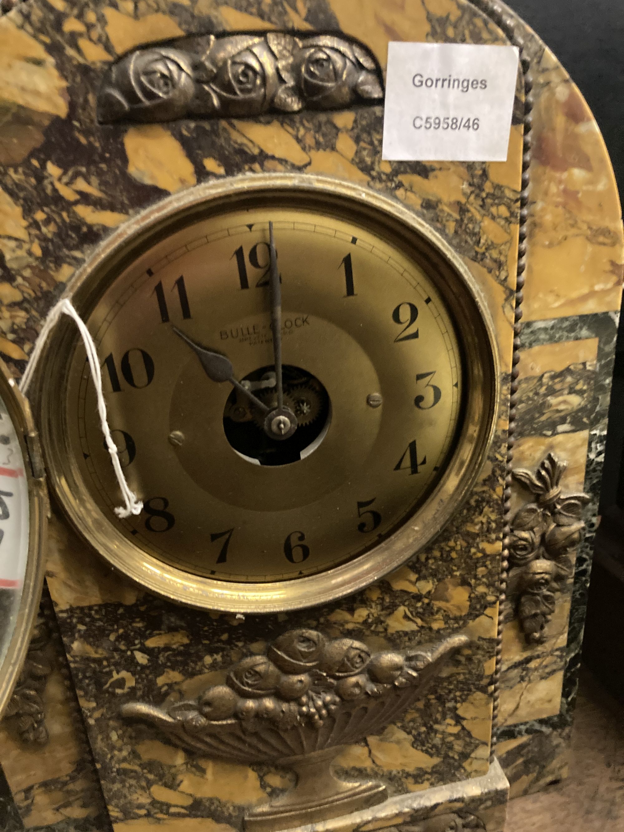 A Bulle black and ochre marble cased electric mantel clock, height 38cm